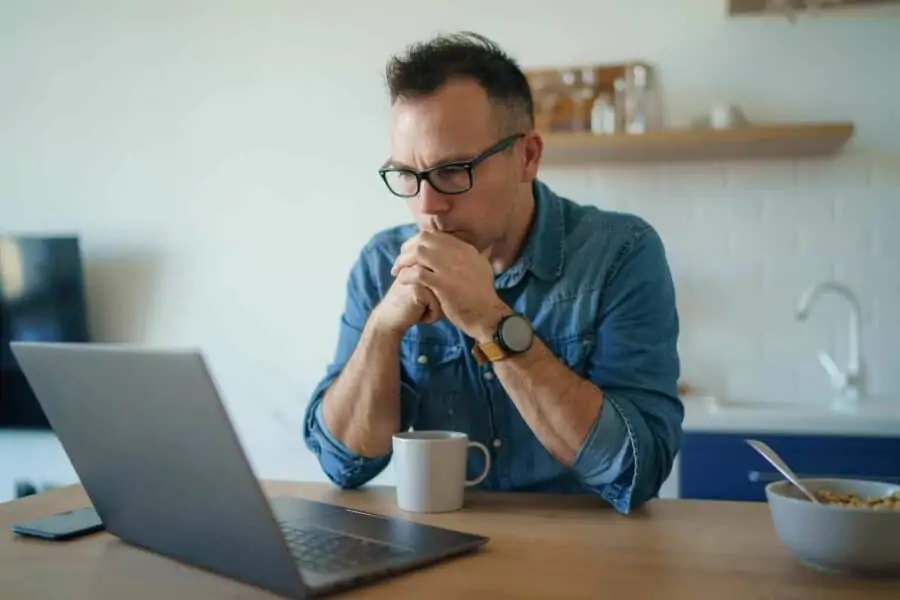 Man facing laptop