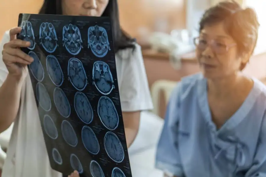 doctor showing patient scan of her brain