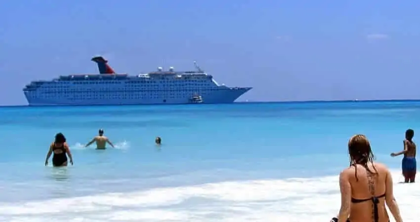 Cruise ship and tourists swimming