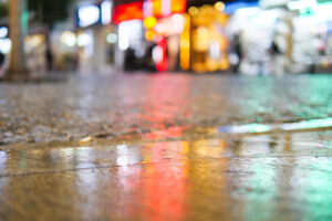 water drops on the rainy day. night view in the city, selective focus .