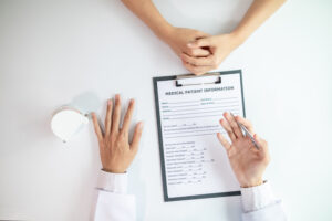 woman consults dentist about her toothache for treatment in dental clinic and dentist gives advice on right symptoms and treatment method for patient. concept consulting dentist about dental treatment